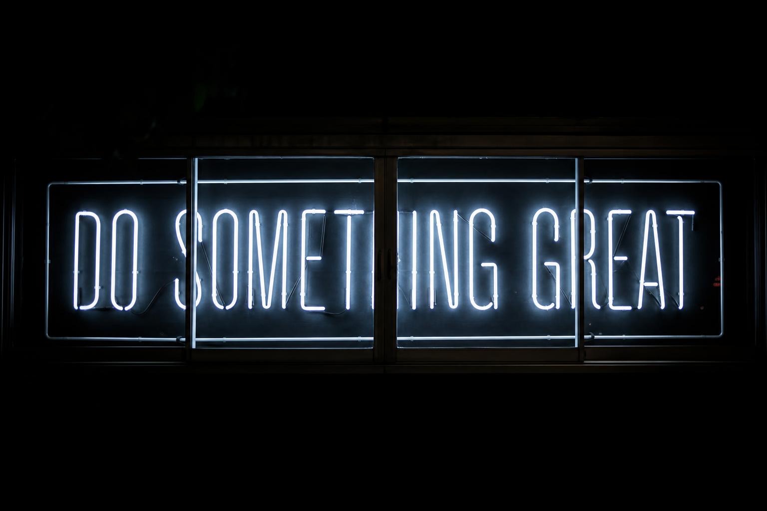 Neon sign reading Do Something Great